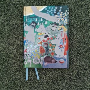 colourful A5 notebook embossed with Moomin images and landscape